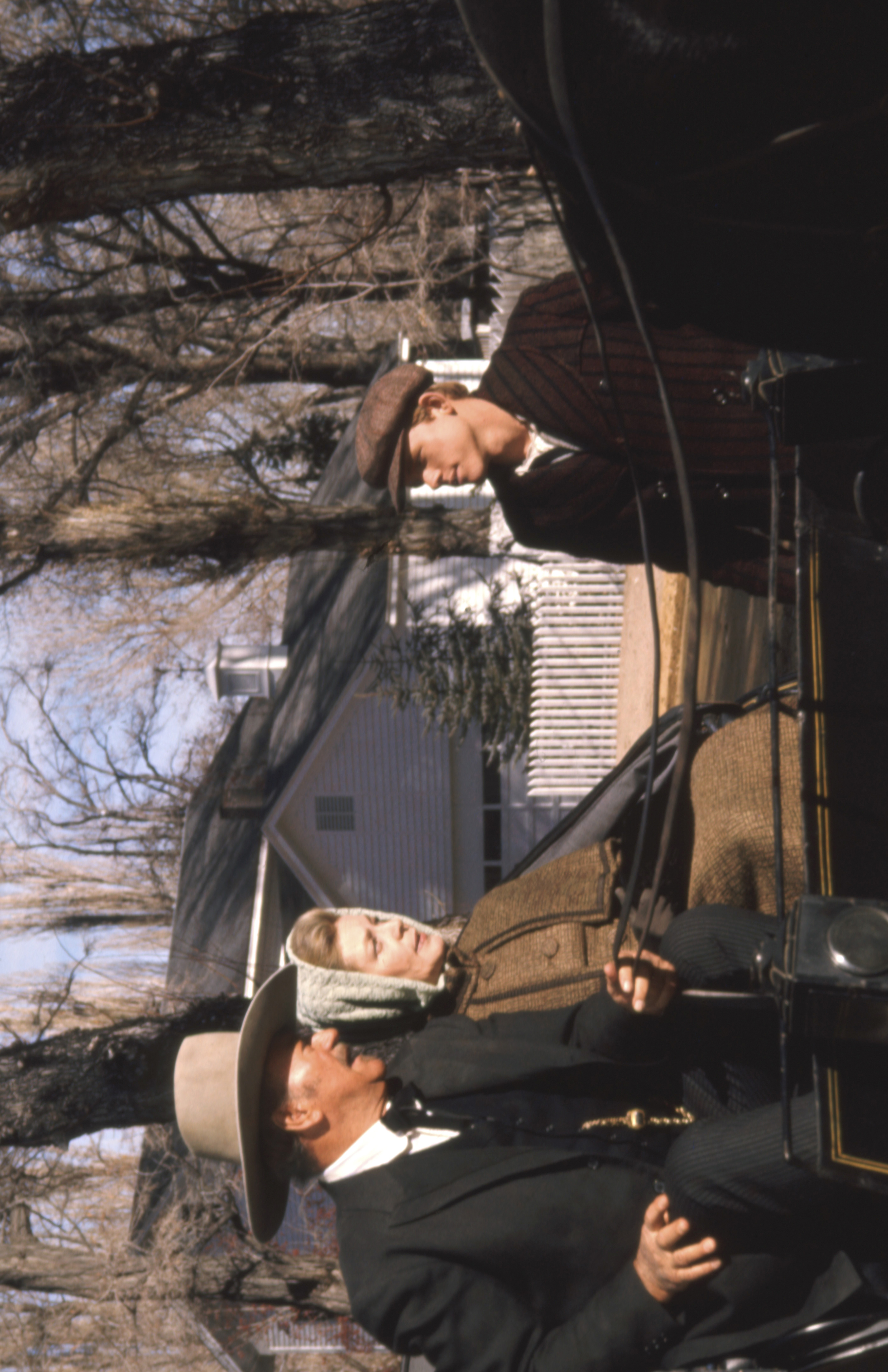 John Wayne, Lauren Bacall and Ron Howard in scene from "The Shootist," circa 1976. | Source: Getty Images