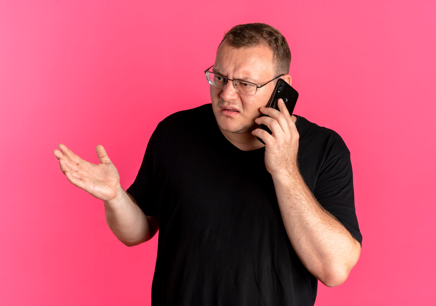 An annoyed man talking on the phone | Source: Freepik