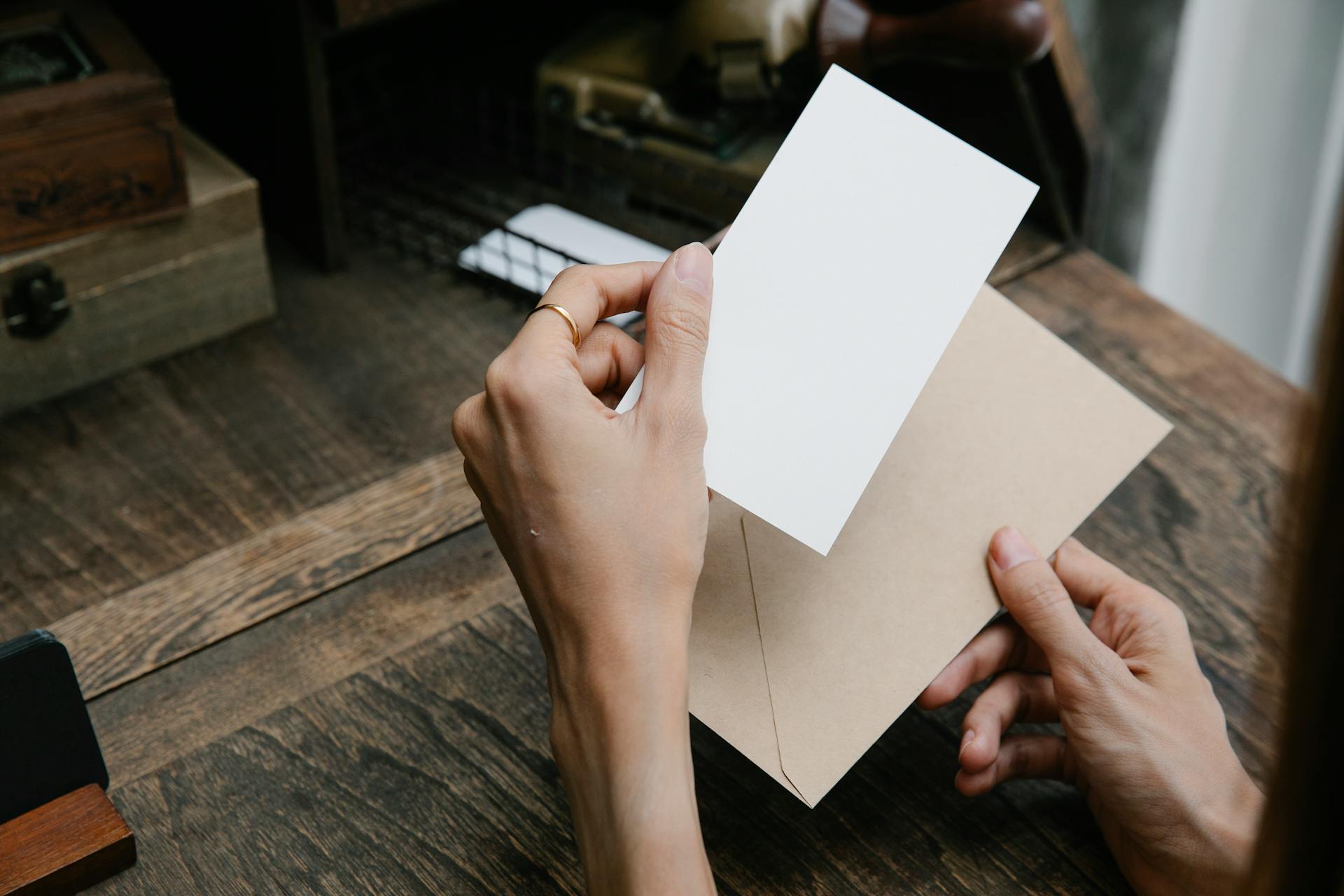 A person opening an envelope | Source: Pexels
