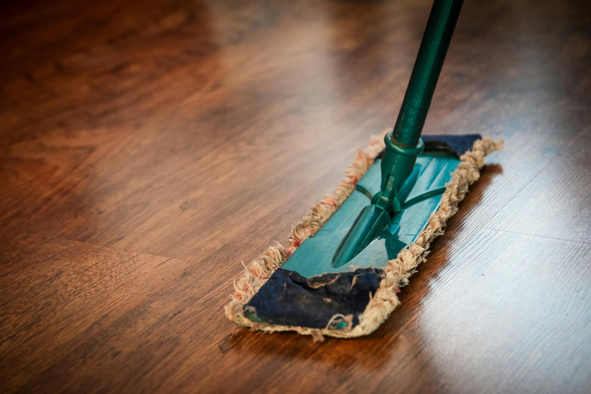 A person mopping the floor | Source: Pexels