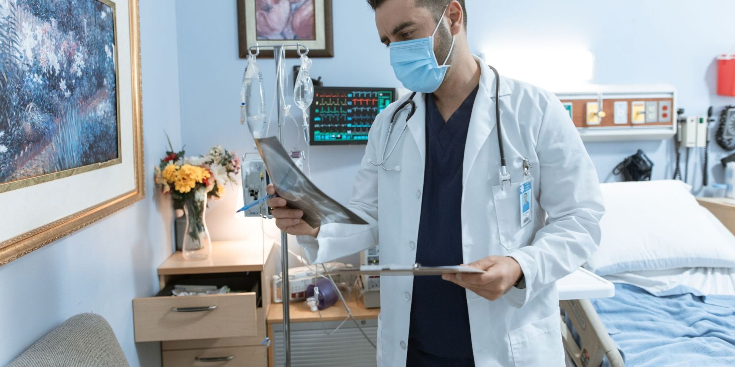 Doctor examining an X-ray in a hospital room | Source: Pexels