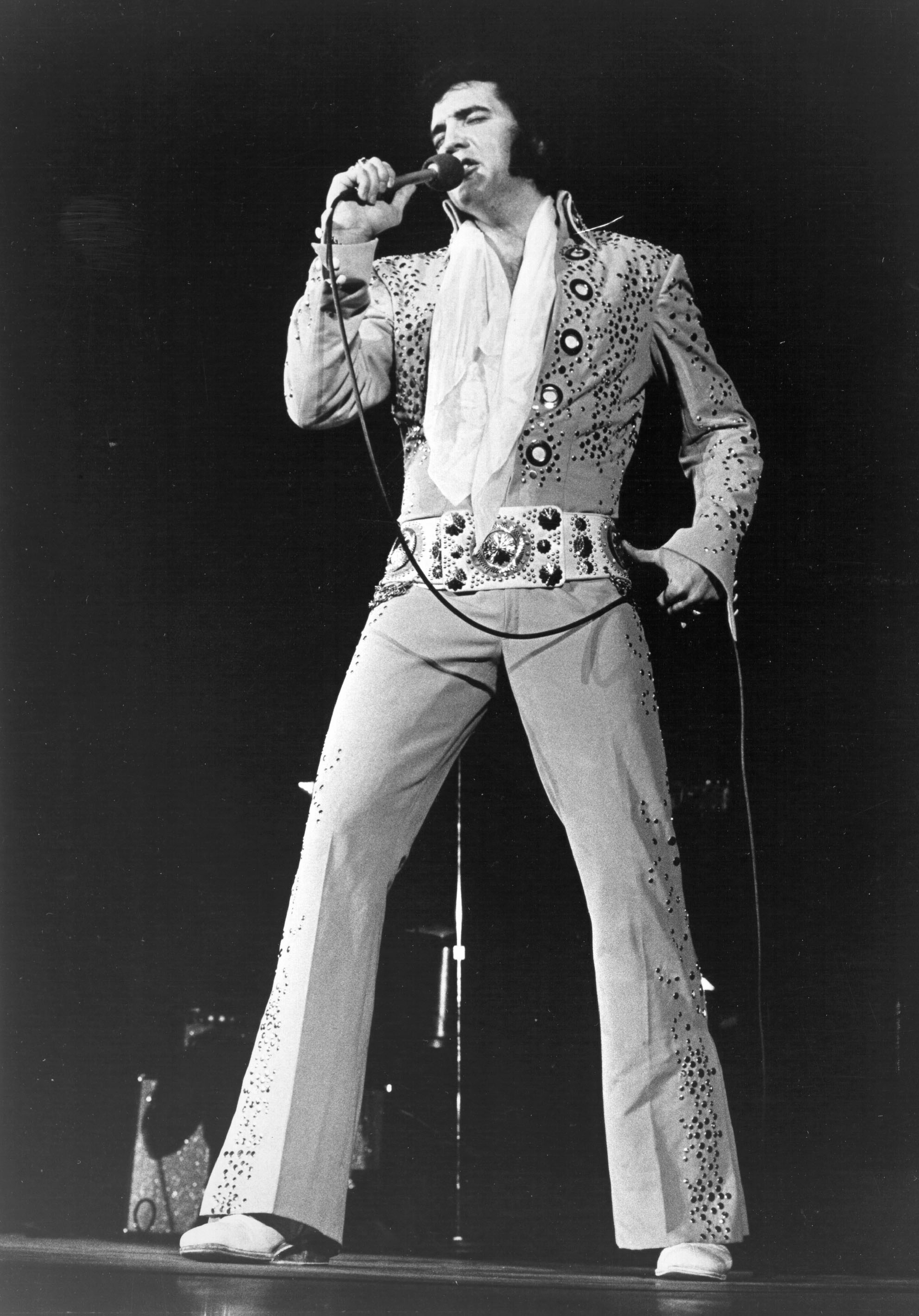 Elvis Presley performing on stage in 1974 | Source: Getty Images
