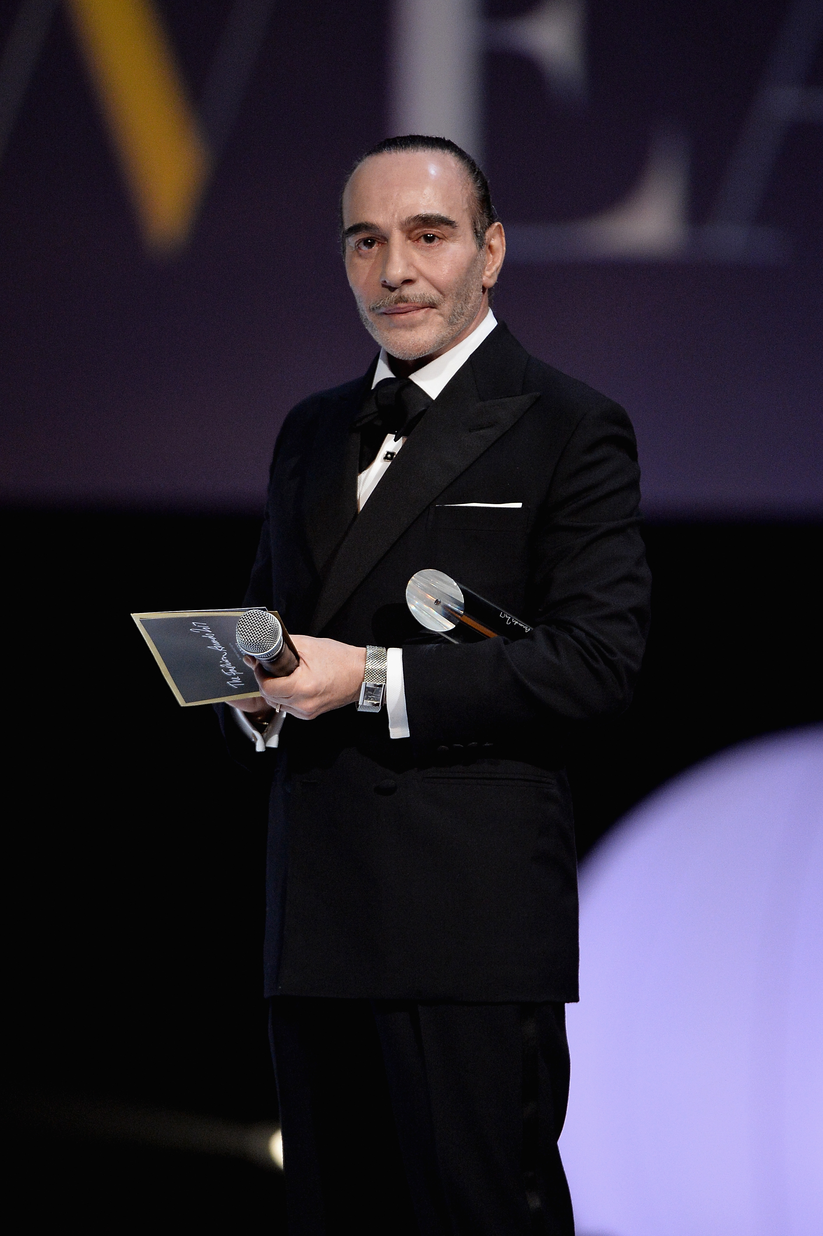 John Galliano presents an award during The Fashion Awards 2017 in partnership with Swarovski at Royal Albert Hall on December 4 in London, England. | Source: Getty Images