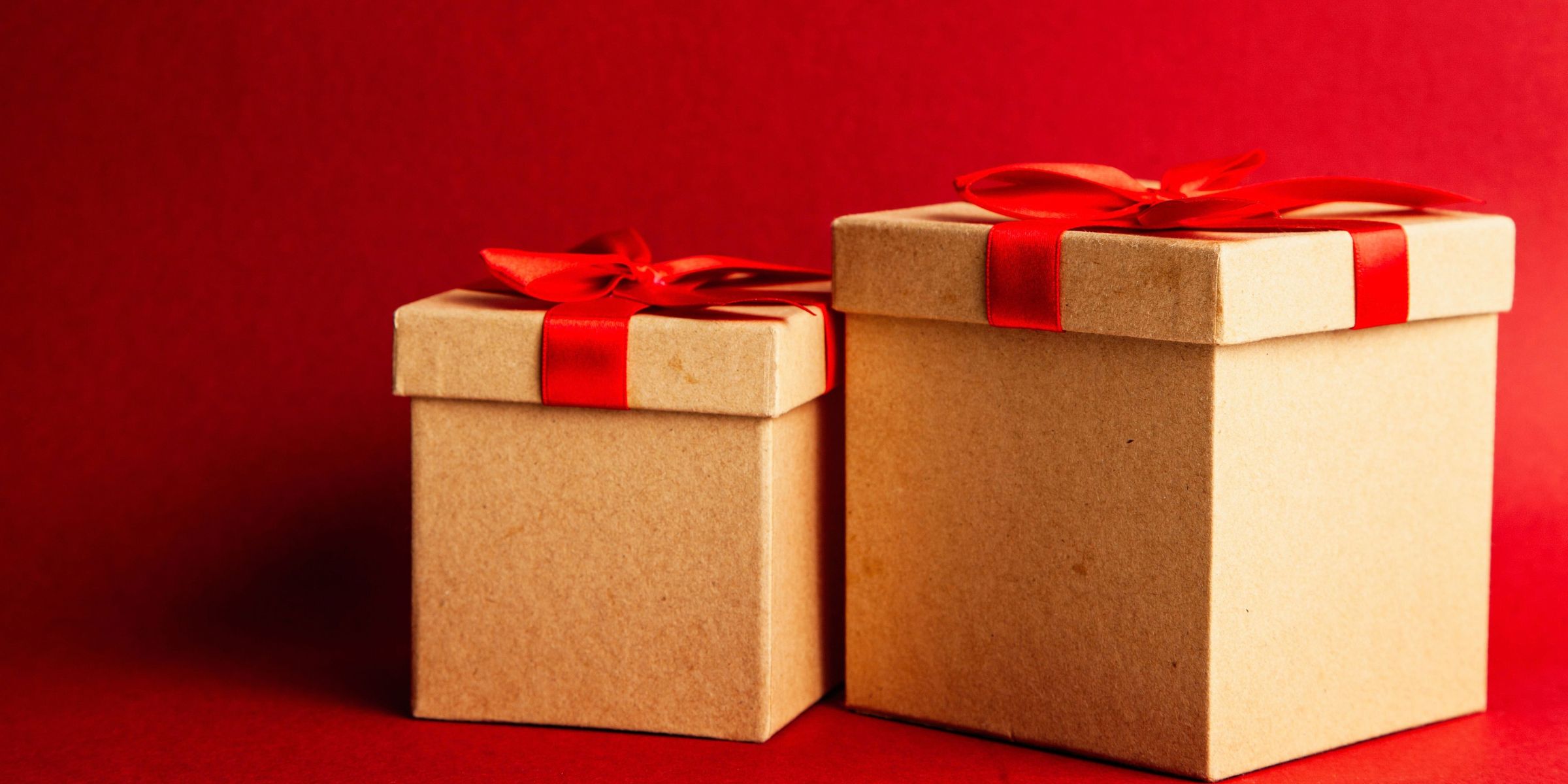 Two gift boxes with red ribbons | Source: Pexels