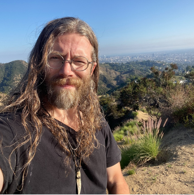 Joshua Brown poses for a selfie on a mountain trail on March 27, 2025 | Source: Instagram/respectthedanger