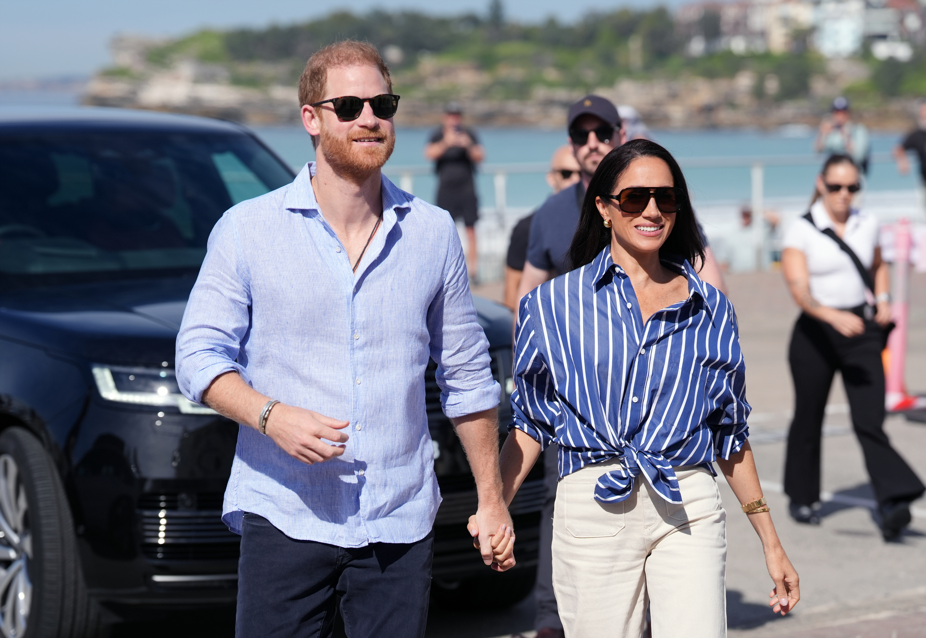 Prince Harry, Duke of Sussex and Meghan, Duchess of Sussex arrive to meet volunteer first responders from Bondi Surf Bathers' Life Saving Club, during a visit to Bondi Beach, on day four of the royal trip to Australia on April 17, 2026 in Sydney, Australia. | Source: Getty Images