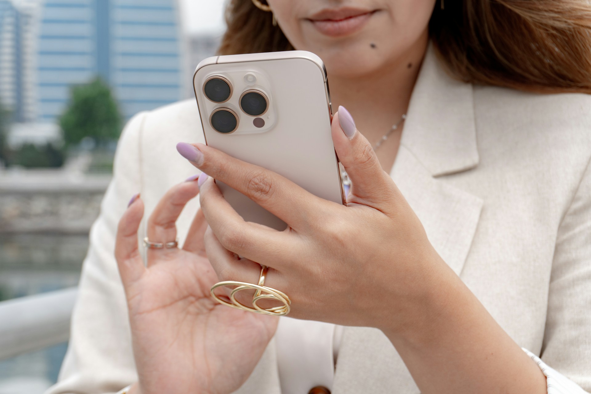 A woman holding her phone | Source: Unsplash