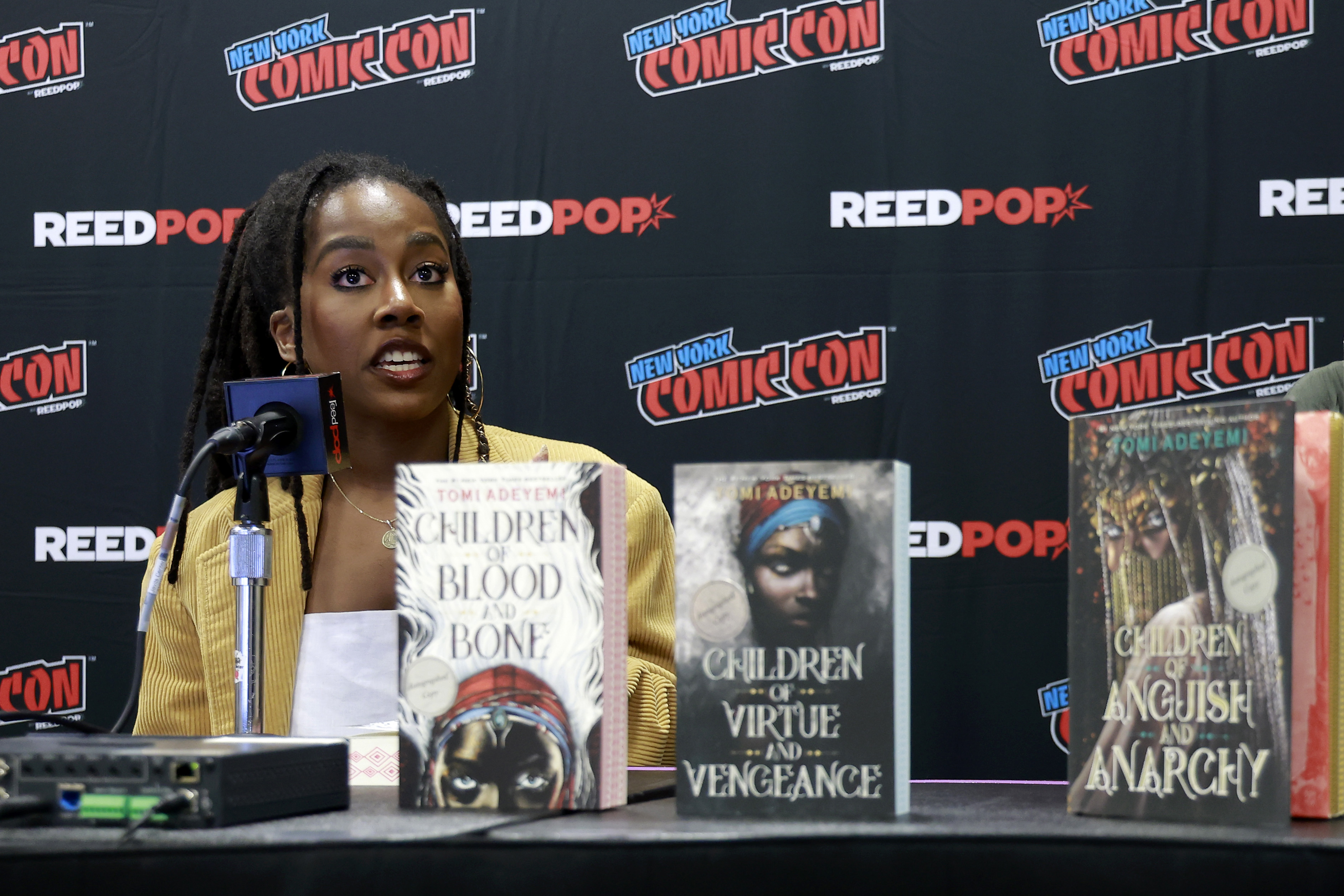 Tomi Adeyemi speaks at Spotlight on Tomi Adeyemi during New York Comic Con 2024 at The Jacob K. Javits Convention Center on October 19. | Source: Getty Images