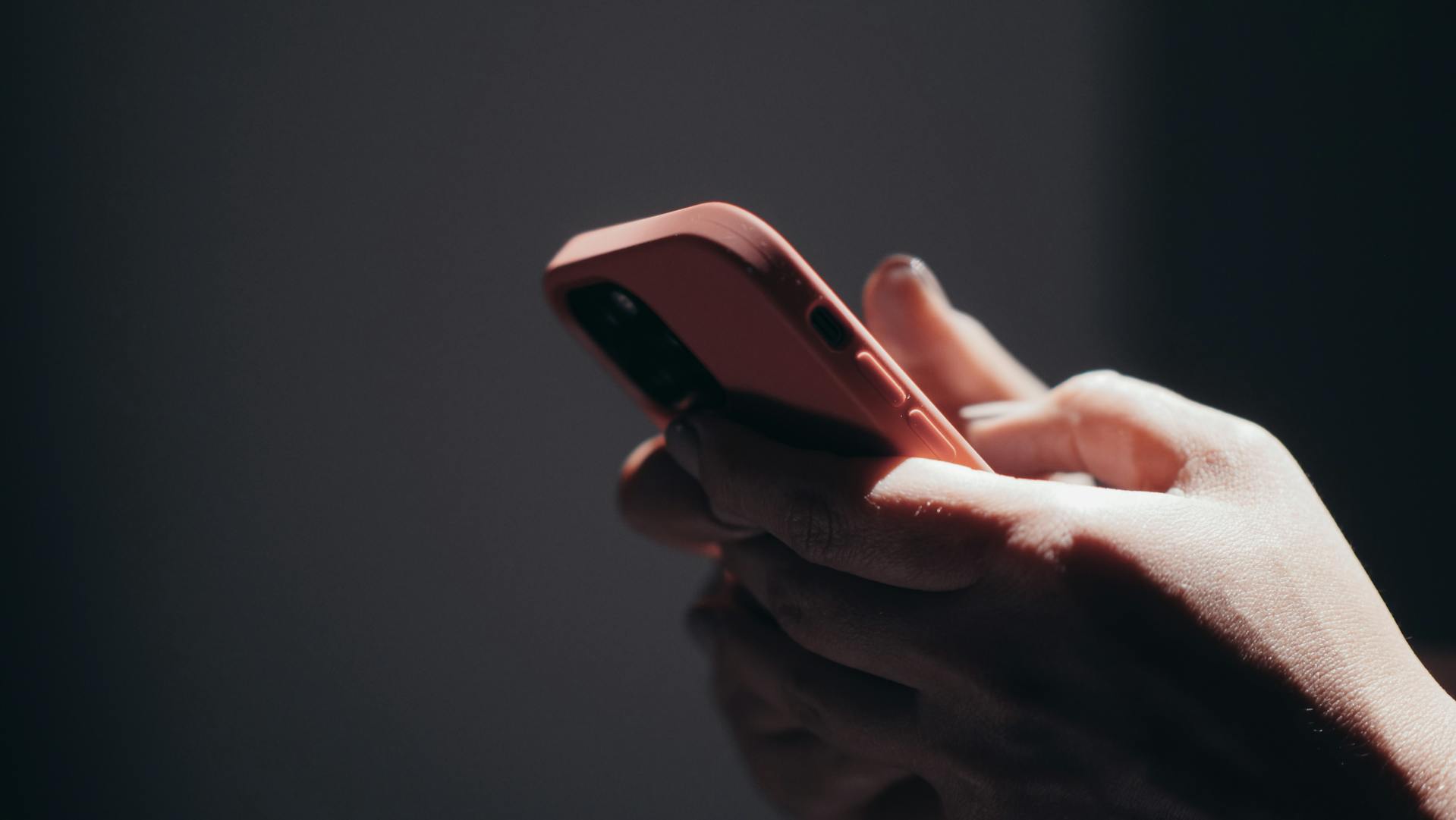 A woman holding a phone | Source: Pexels