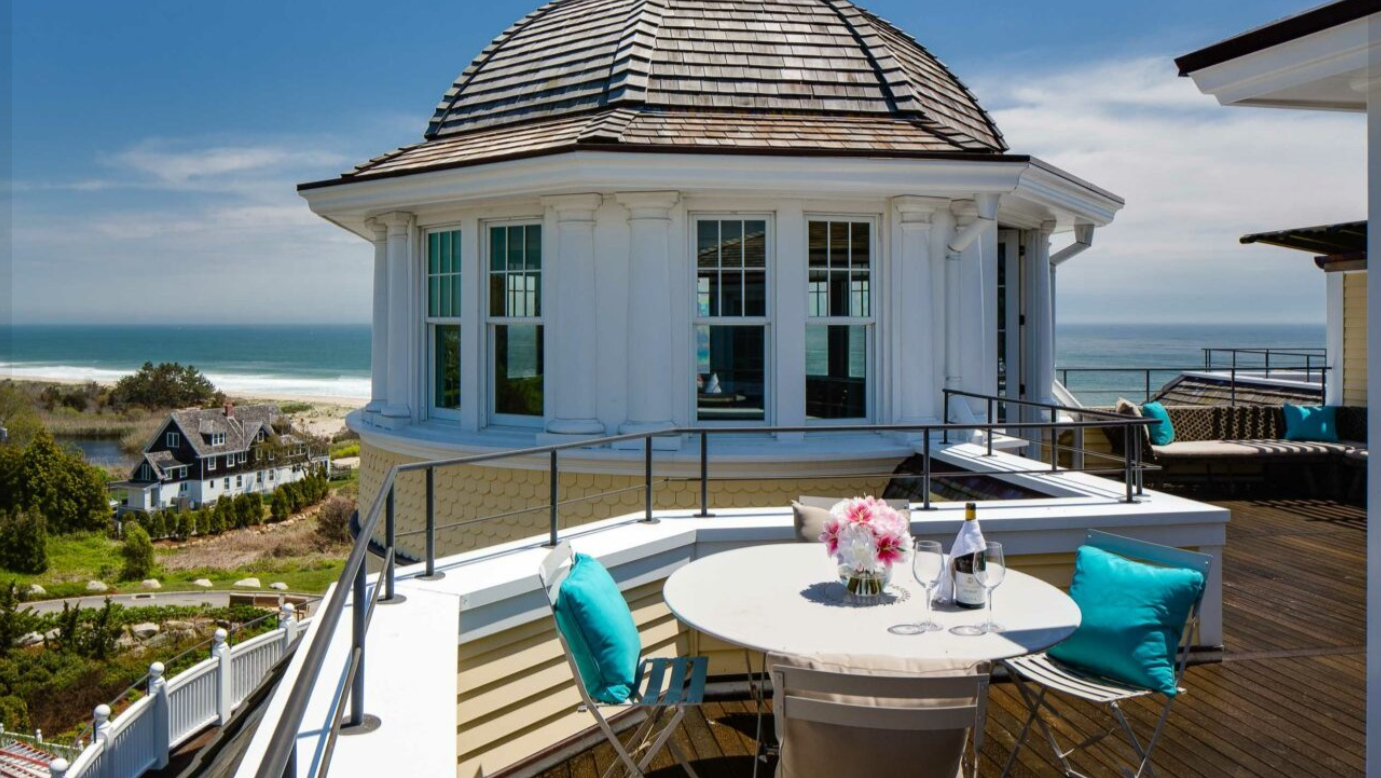 A private terrace overlooks Rhode Island's coastline, showcasing the scenic backdrop that has made the resort a sought-after destination for special occasions. | Source: Facebook/Ocean House RI