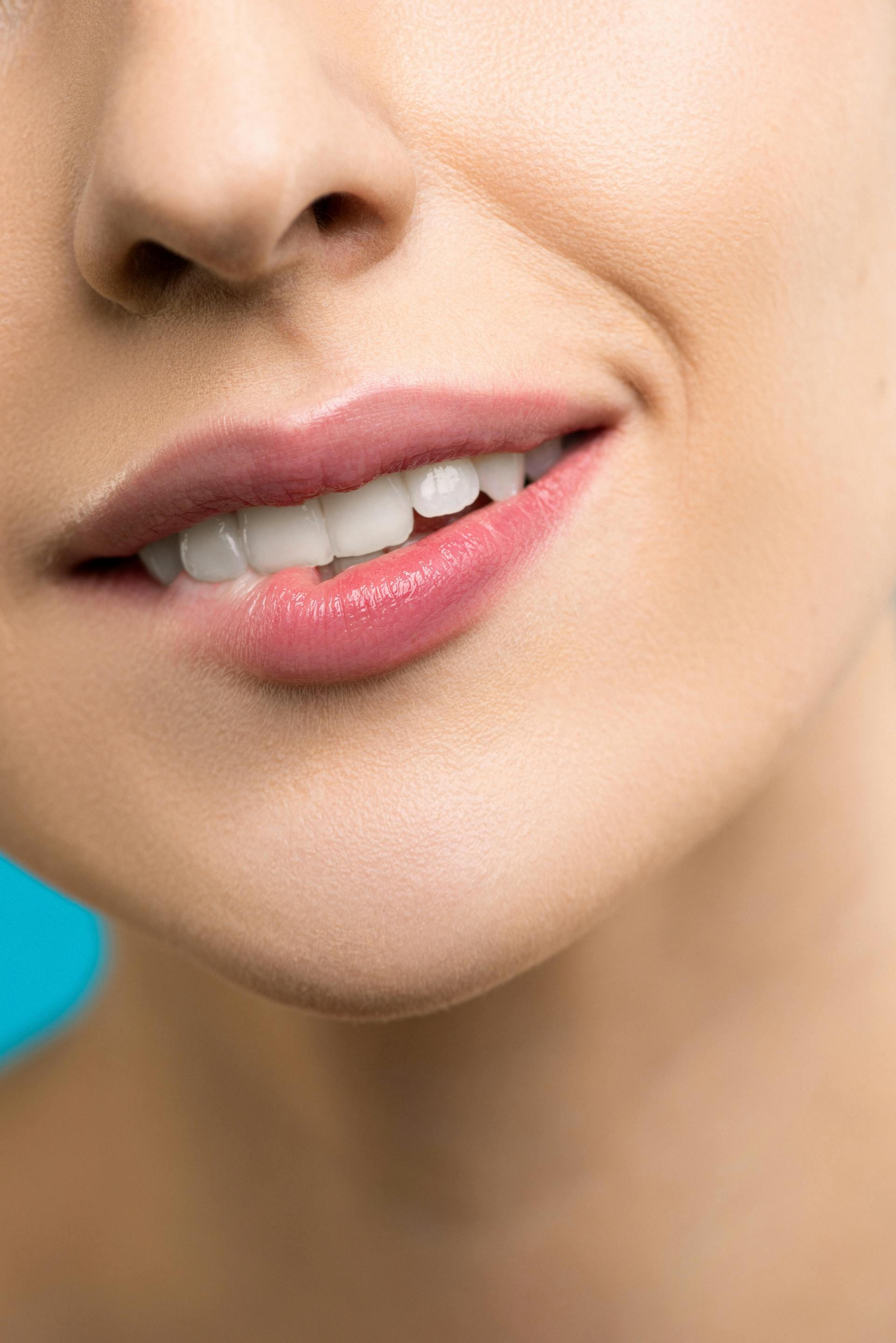 A woman biting her lip while smiling | Source: Pexels