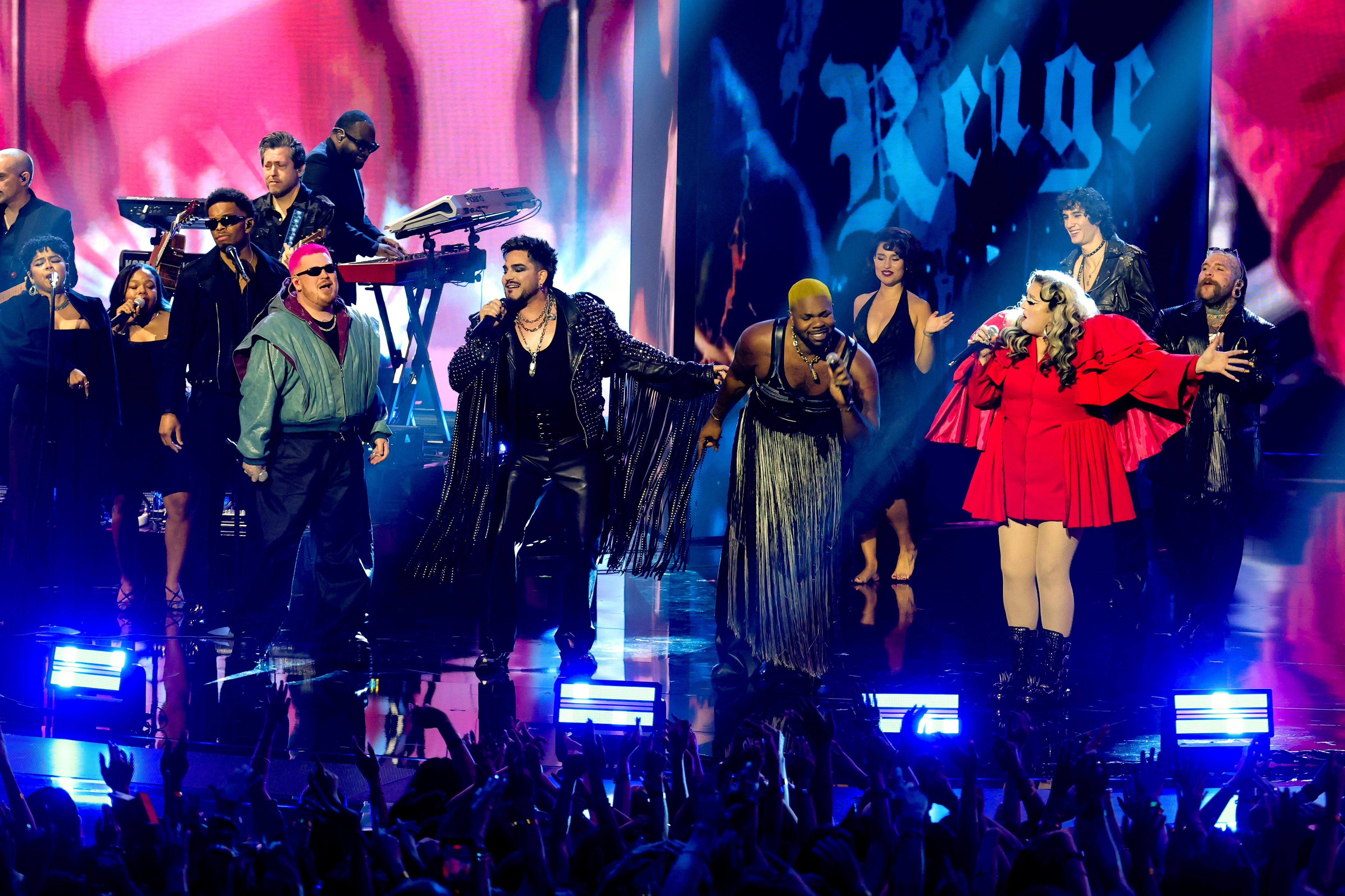 (-R) Saint Harison, Adam Lambert, MNEK, Raye, Meek, Sombr, and Teddy Swims perform a tribute to George Michael onstage during the 2026 MTV Video Music Awards (VMAs) at Peacock Theater on September 27 in Los Angeles, California. | Source: Getty Images