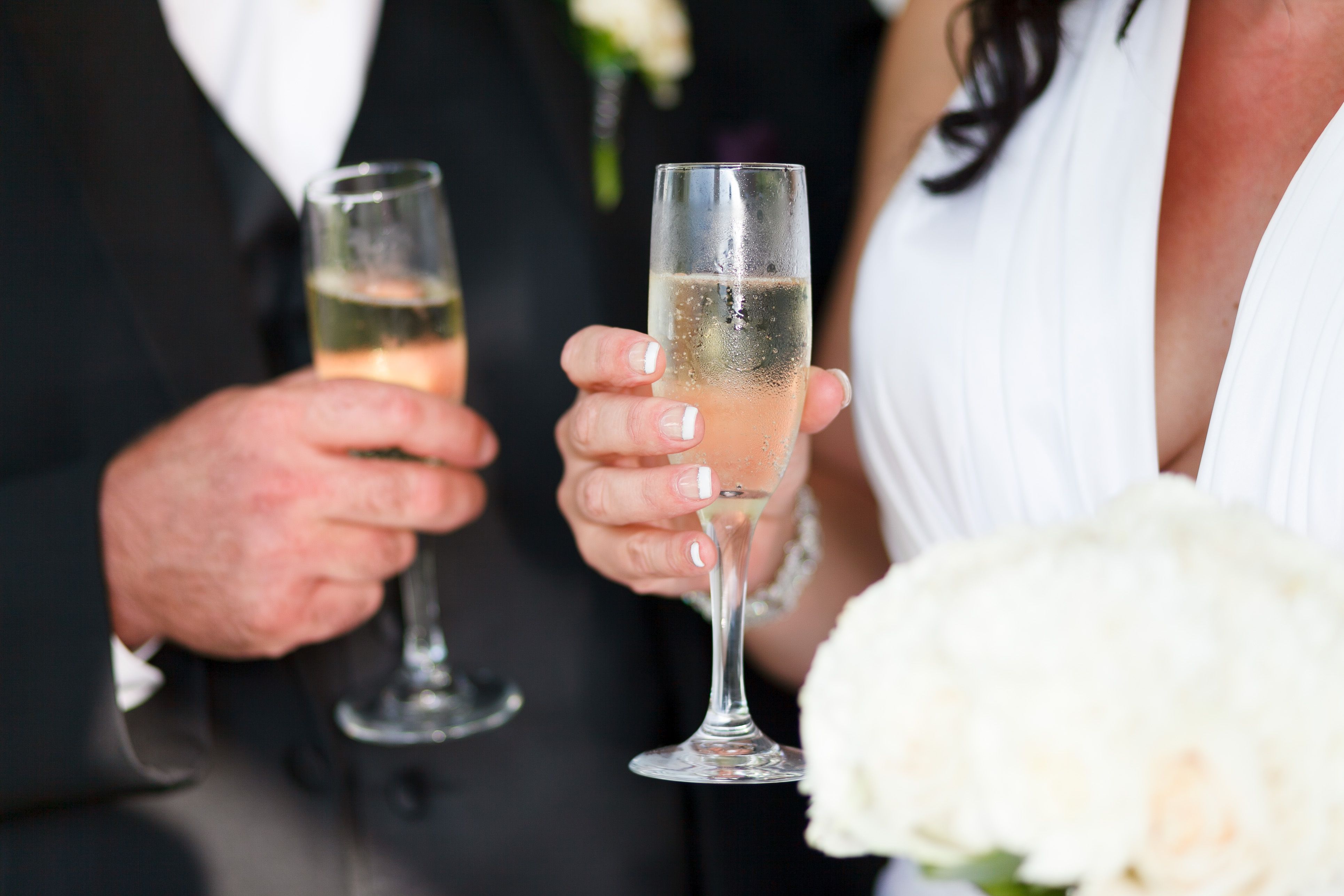 Bride and groom toasting with champagne at their wedding celebration | Source: Pexels