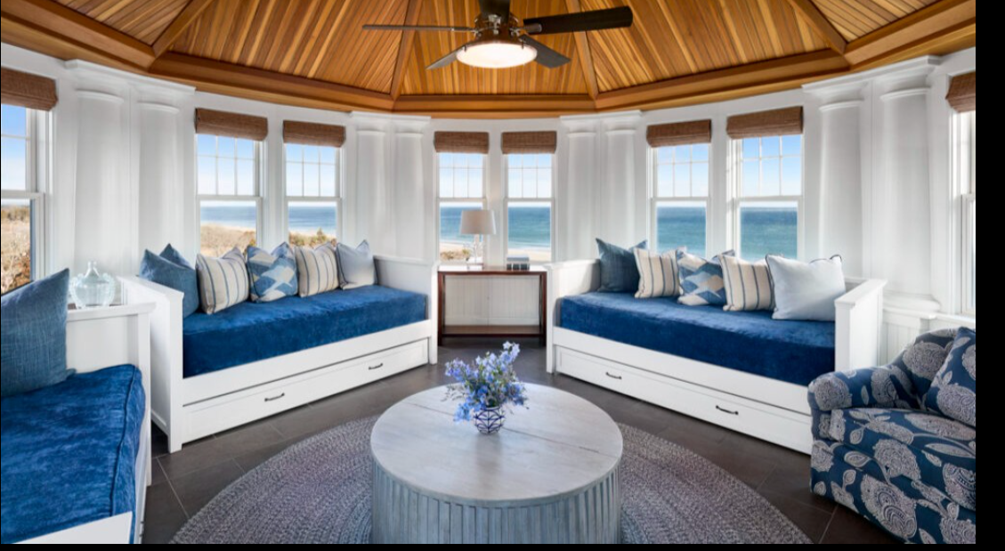 A bright gathering space inside the resort offers panoramic waterfront views through floor-to-ceiling windows. | Source: Facebook/Ocean House RI