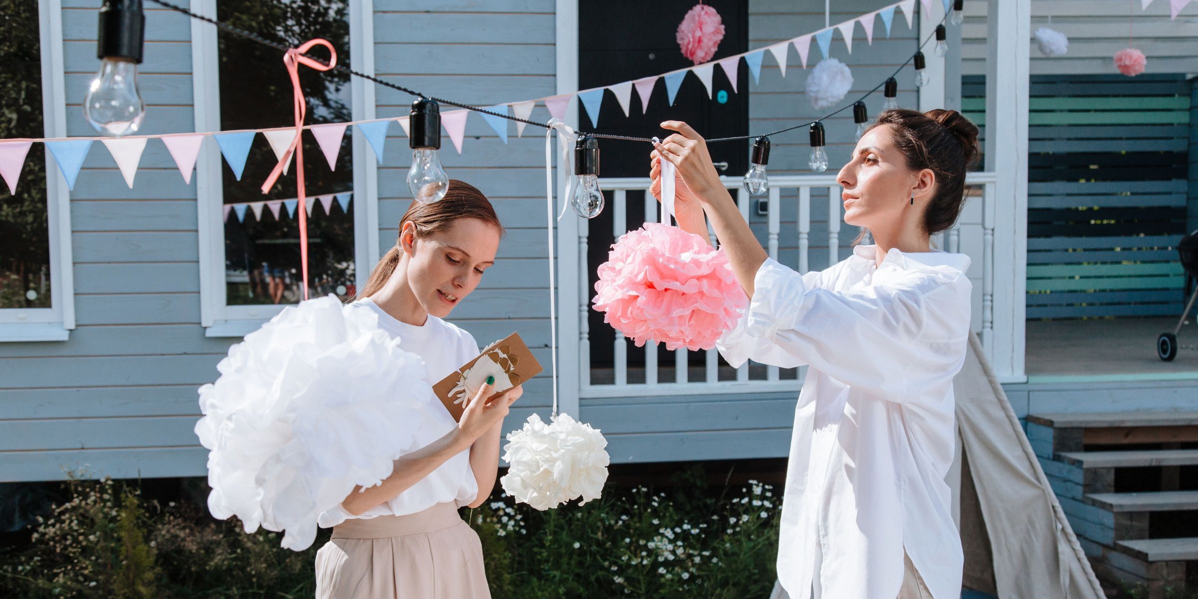 Two woman decorating for a party | Source: Pexels