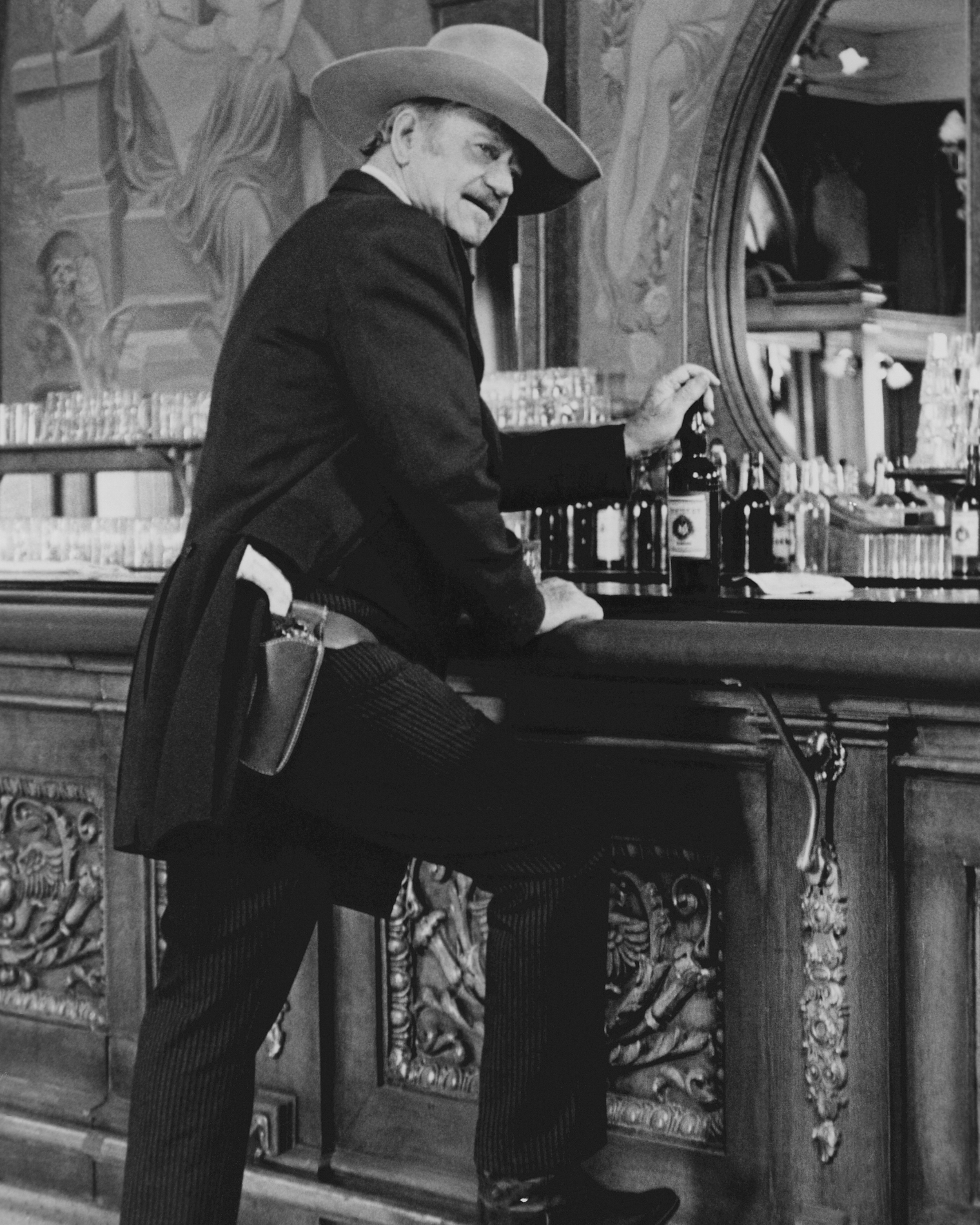 John Wayne (1907 - 1979) as JB Books in a scene from the film "The Shootist" (directed by Don Siegel), circa 1976. | Source: Getty Images