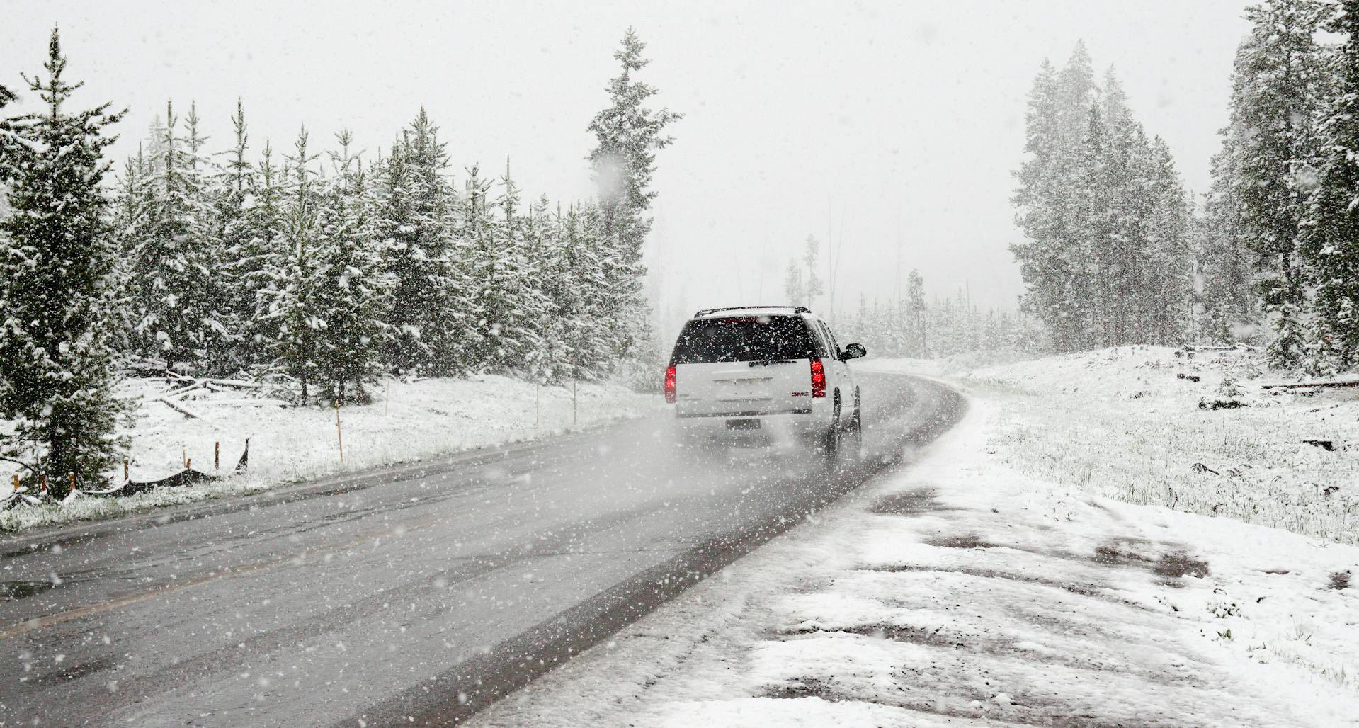 A car driving on a snowy road | Source: Pexels