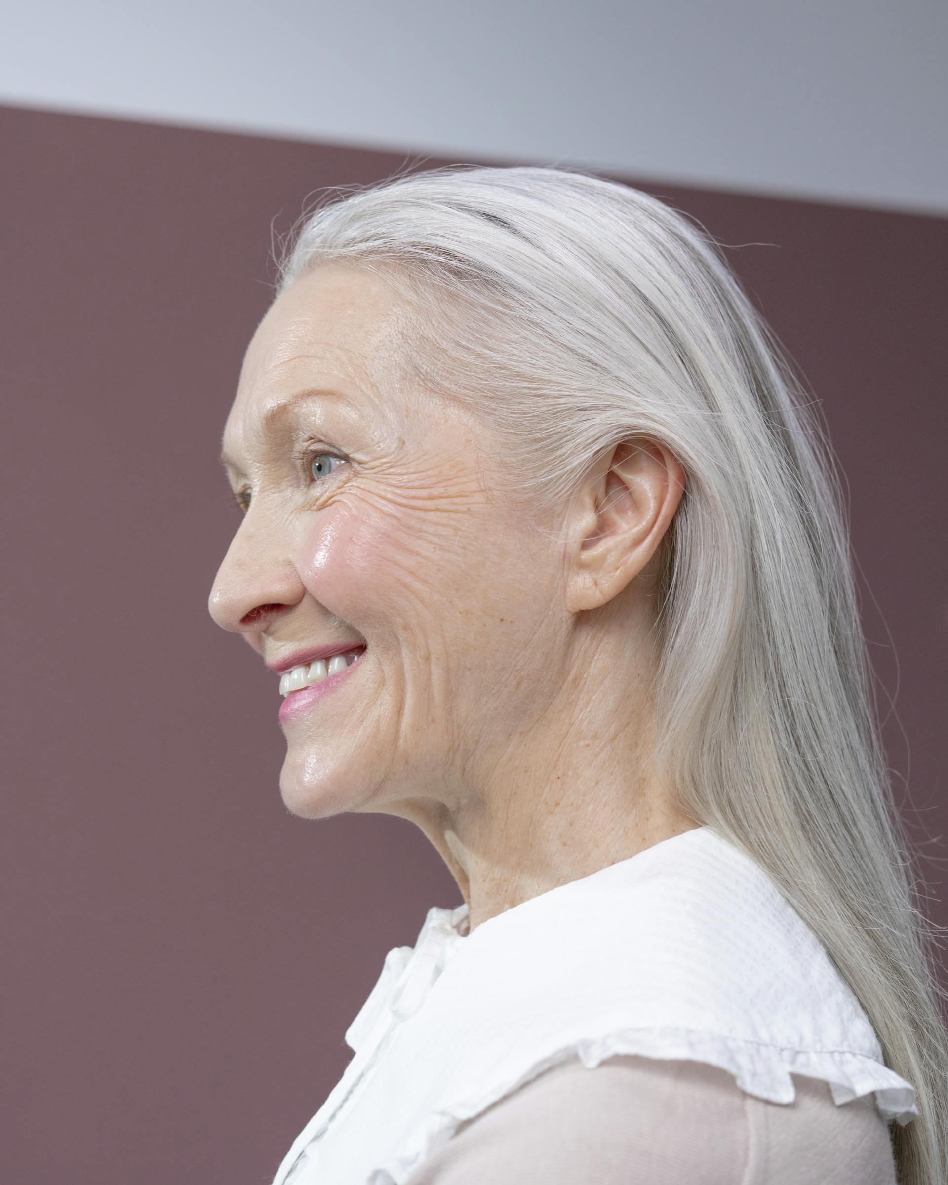 A woman smiling at someone | Source: Pexels