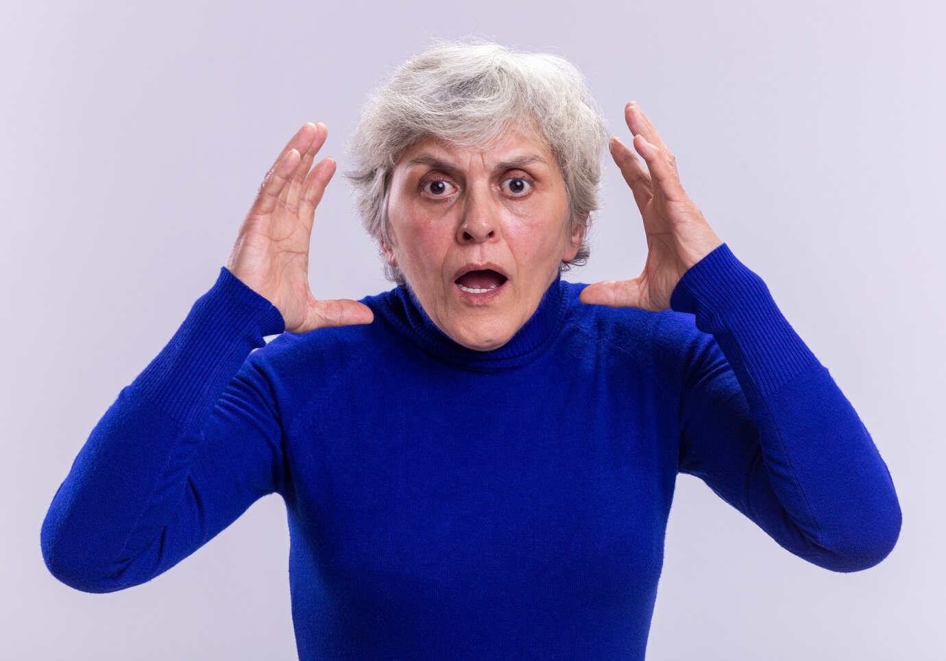 A shocked elderly woman | Source: Freepik