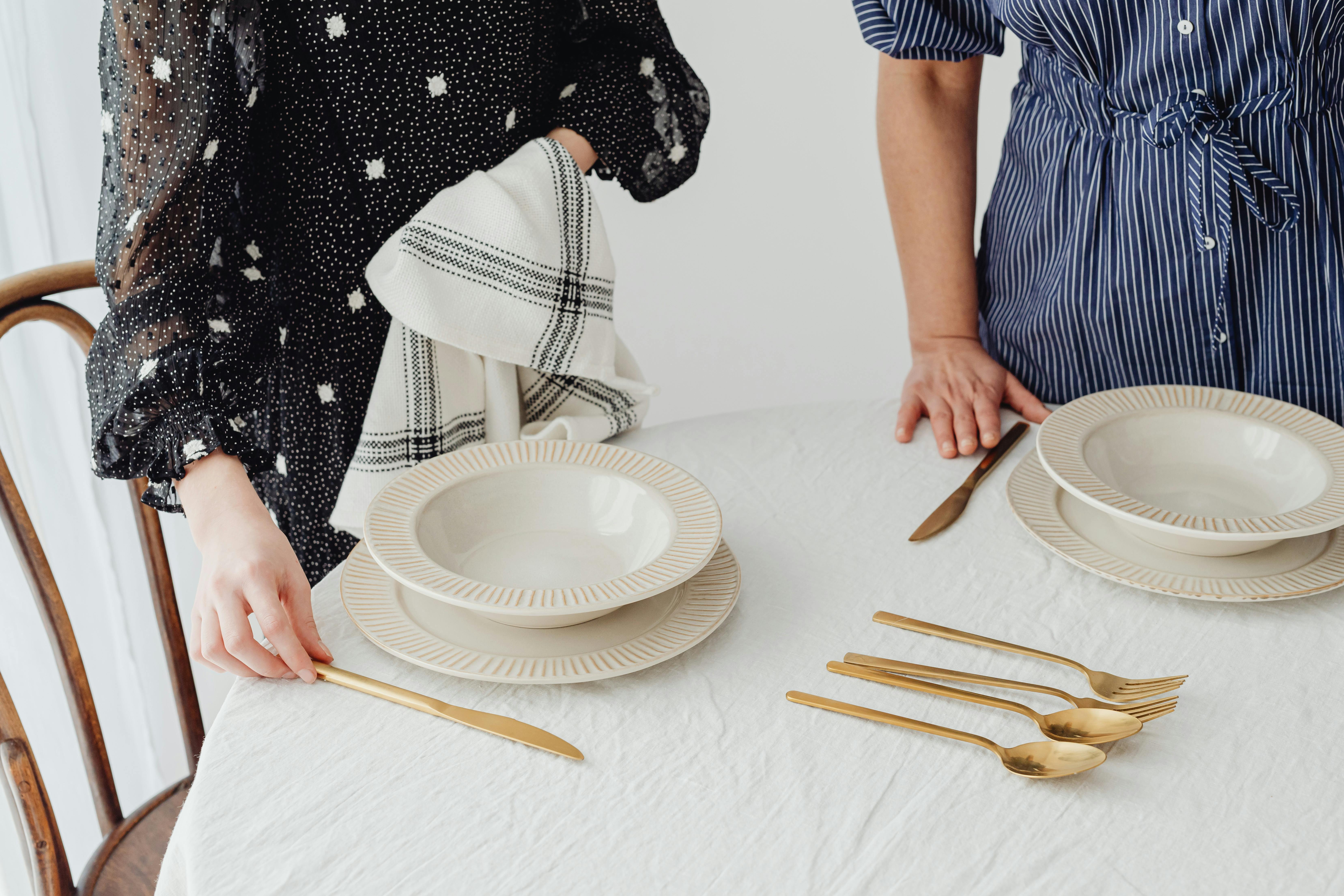 Women setting the table | Source: Pexels