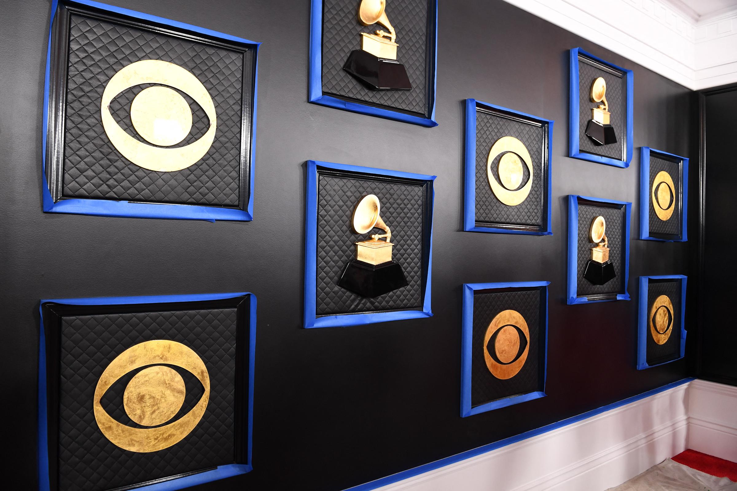 The CBS and Grammy logos are seen on a backdrop as the celebrity arrival area is being set up ahead of the 62nd Annual Grammy awards at LA Live, in California, on January 24, 2020. | Source: Getty IMages