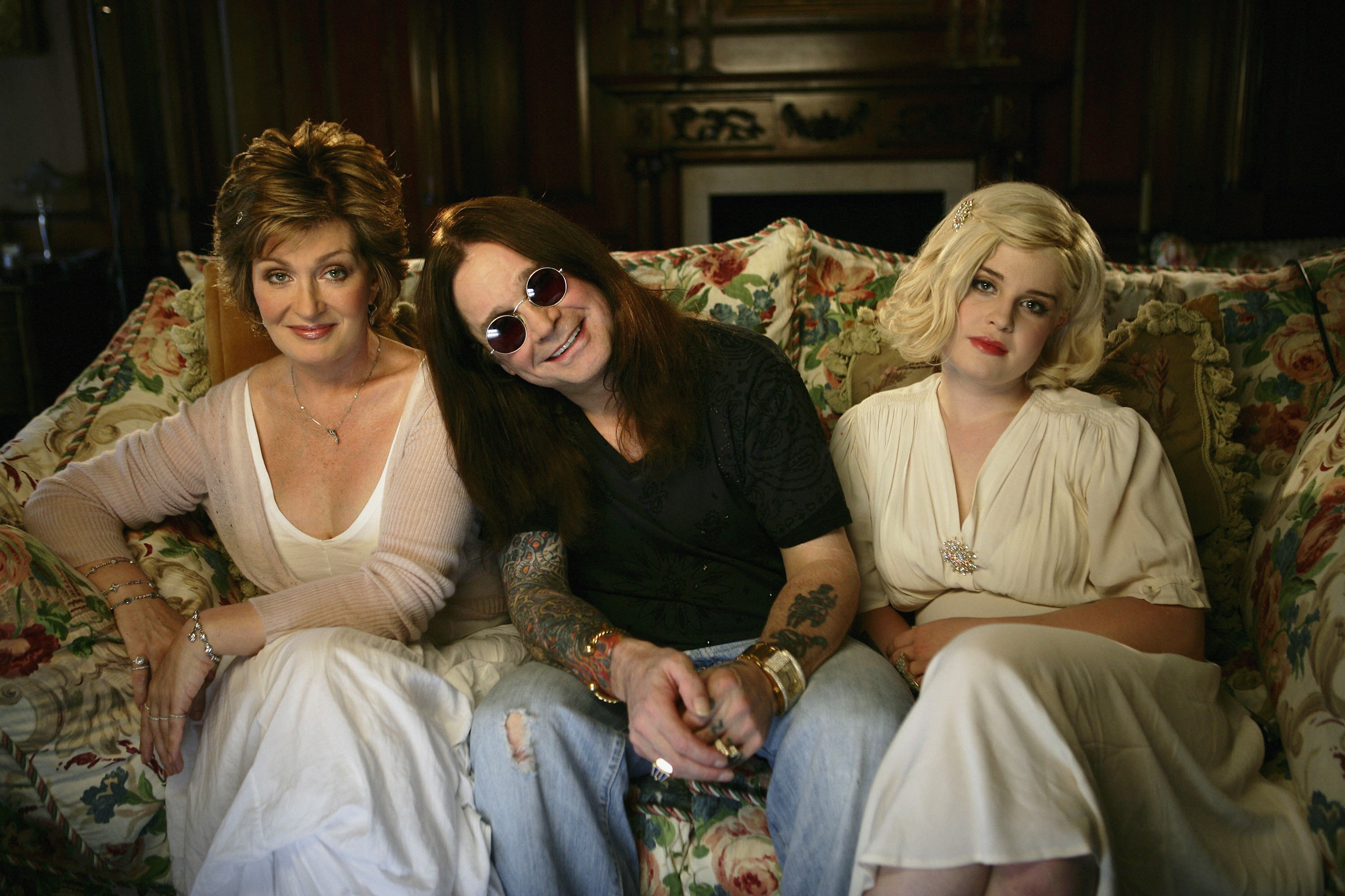 Ozzy Osbourne, wife Sharon (L) and daughter Kelly (R) pose for a portrait shoot at their home in Buckinghamshire on June 12, 2006 in England. | Source: Getty Images
