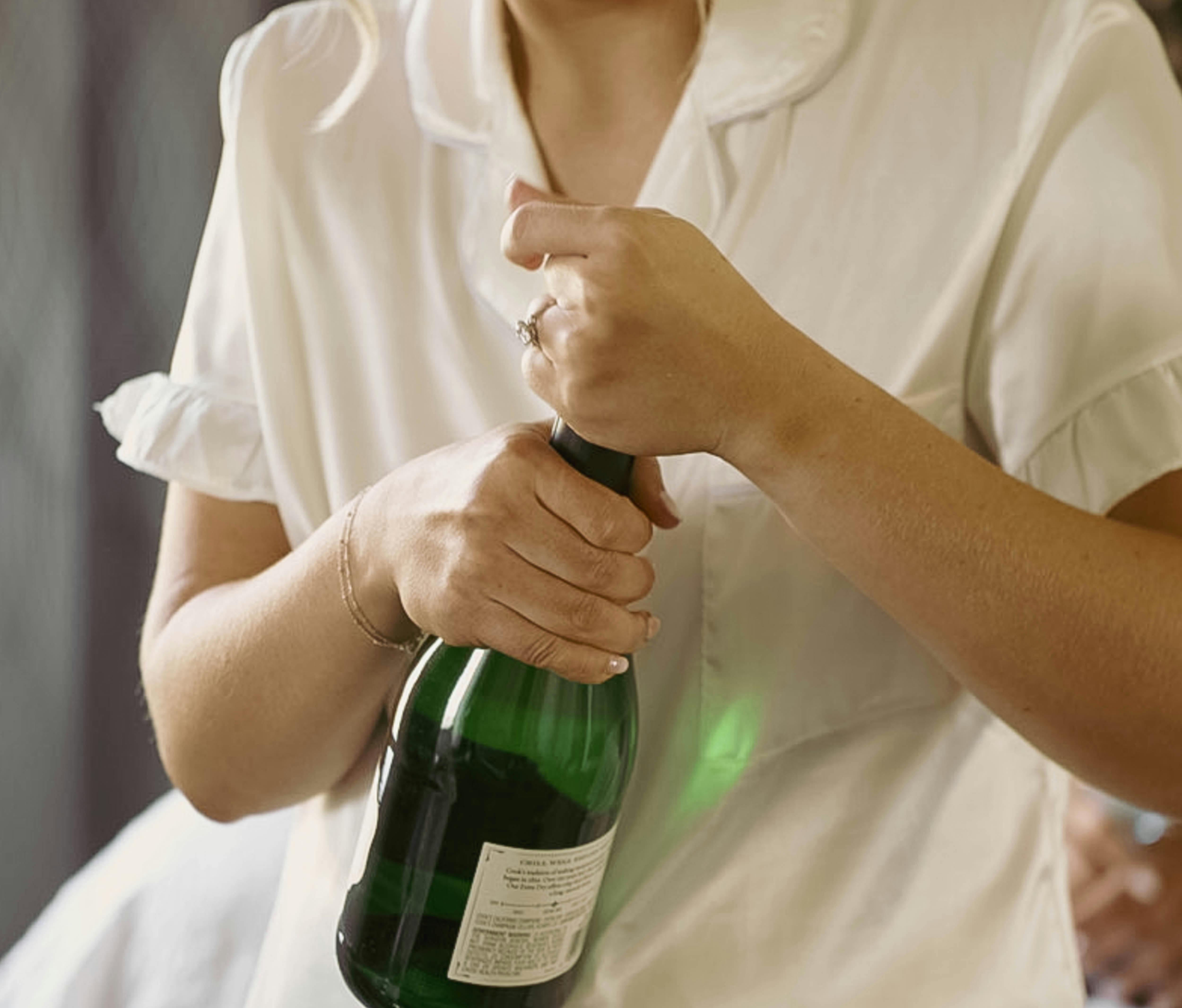A person holding a bottle of champagne | Source: Pexels
