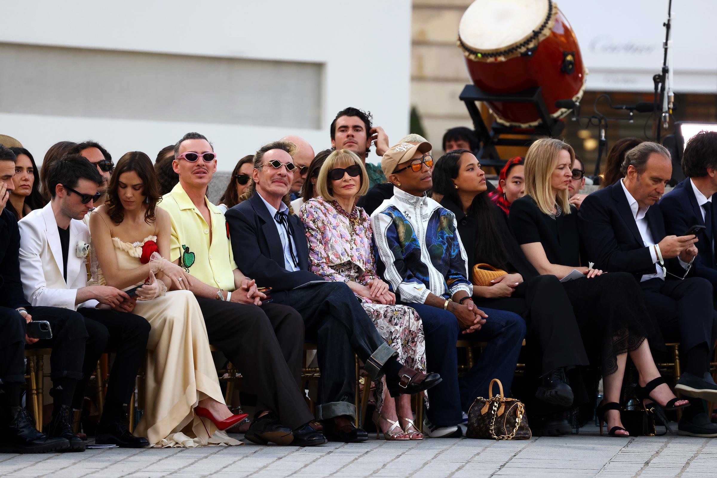 Tom Sturridge, Alexa Chung, Alexis Roche, John Galliano, Anna Wintour, Pharrell Williams, Helen Williams, Delphine Arnault and Xavier Niel during Vogue World: Paris at Place Vendome on June 23, 2024 in Paris, France. | Source: Getty Images