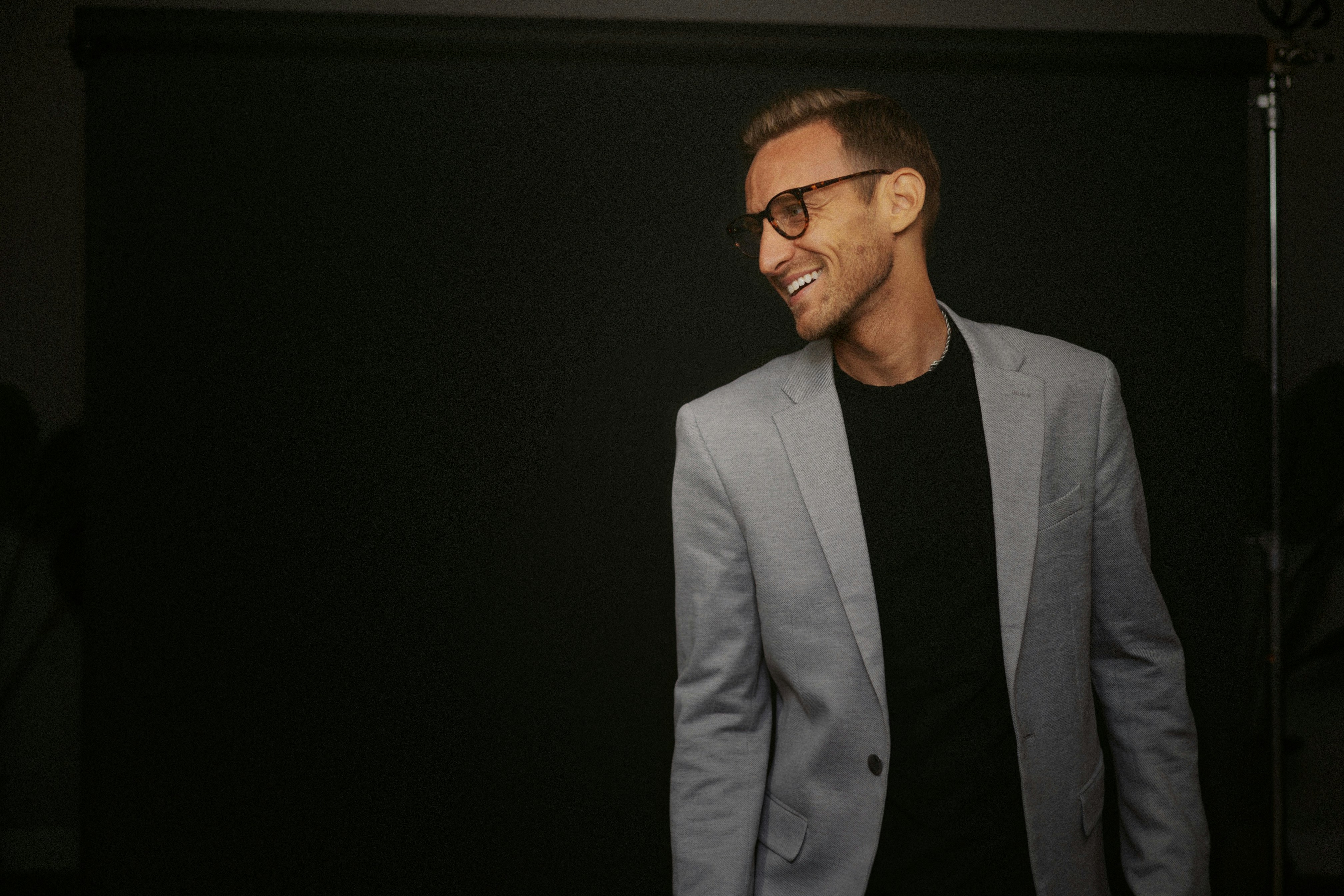 A happy man in a suit | Source: Unsplash