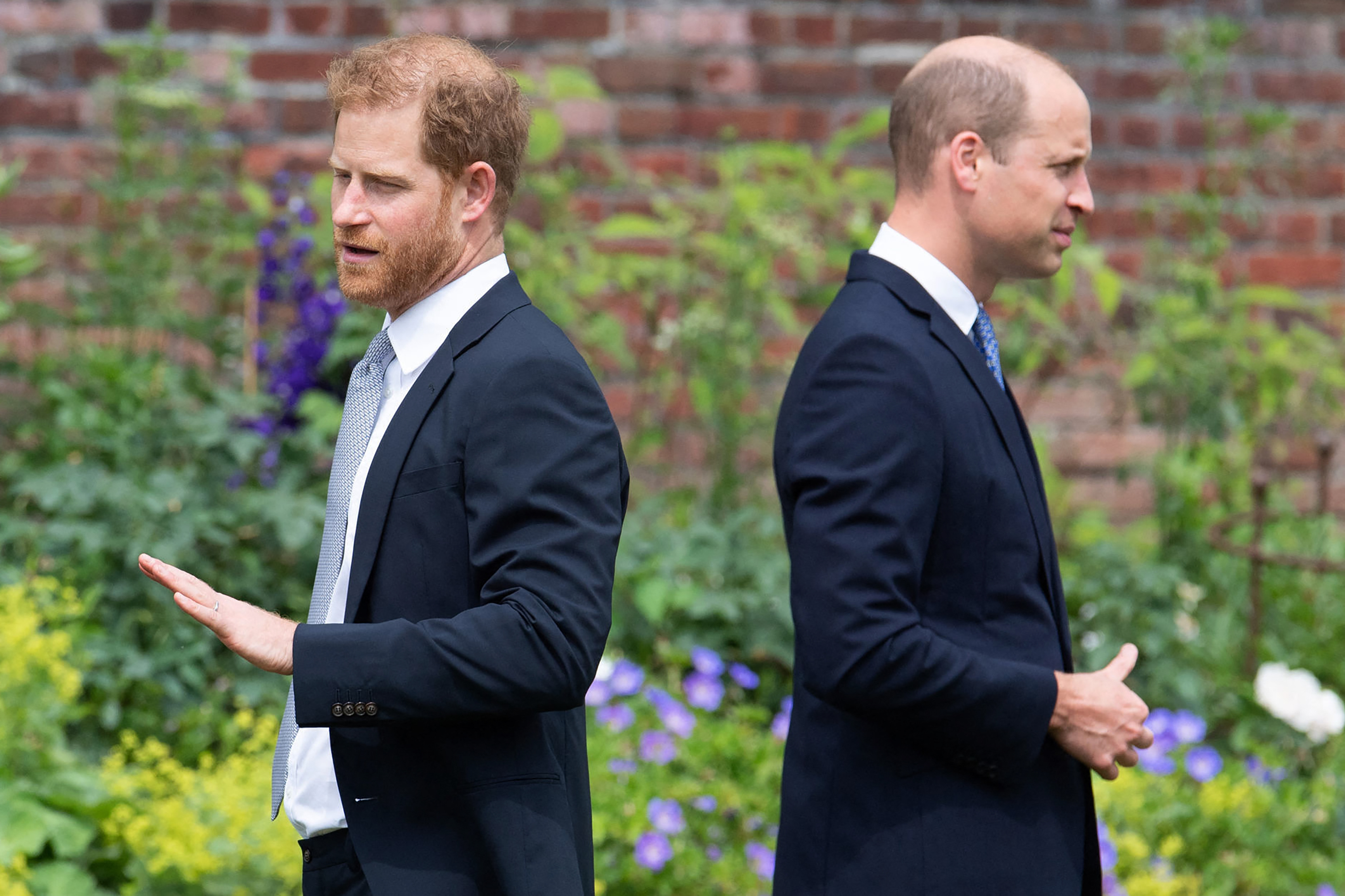 Prince Harry, Duke of Sussex (L) and Prince William, Duke of Cambridge attend the unveiling of a statue of their mother, Princess Diana, at The Sunken Garden in Kensington Palace, London on July 1, 2021, which would have been her 60th birthday. | Source: Getty Images