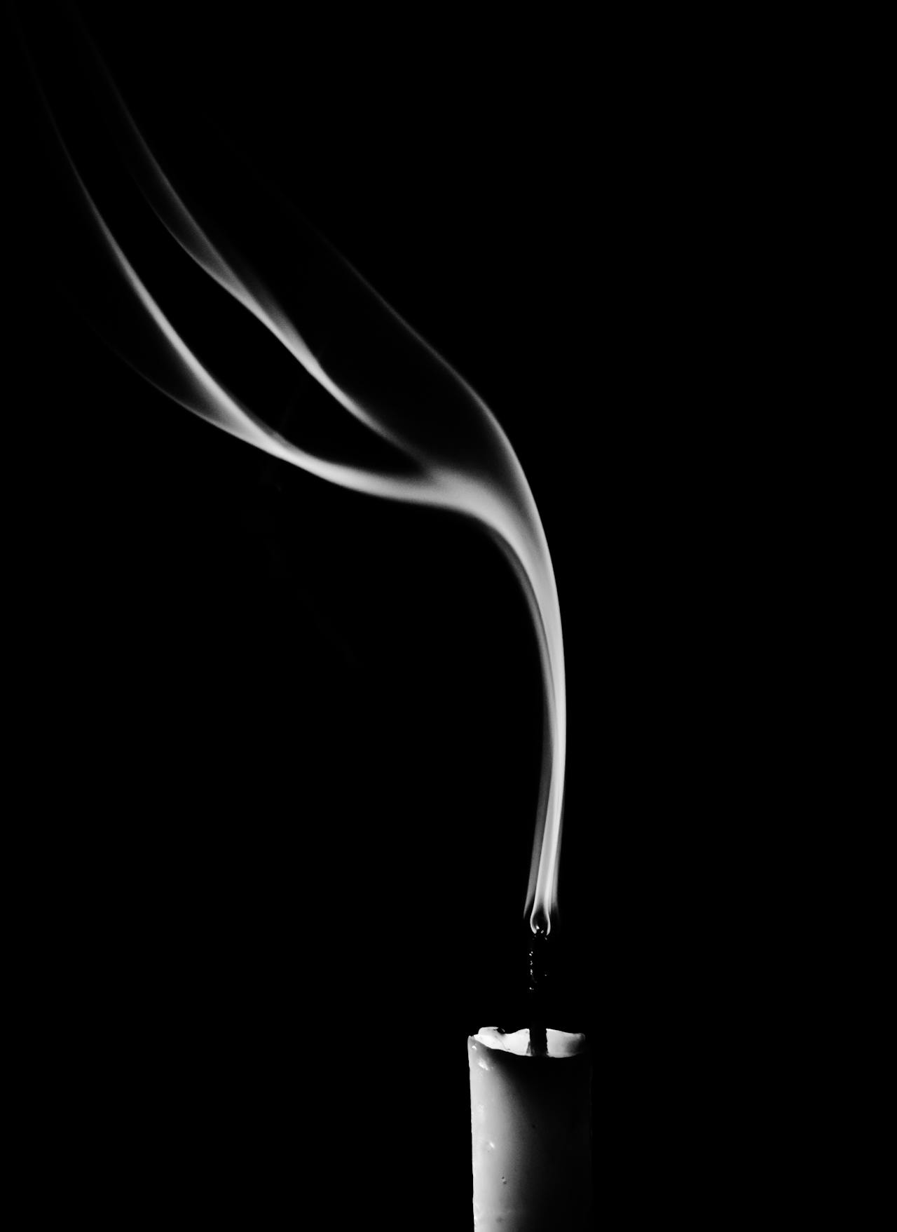 Grayscale shot of a blown-out candle | Source: Pexels