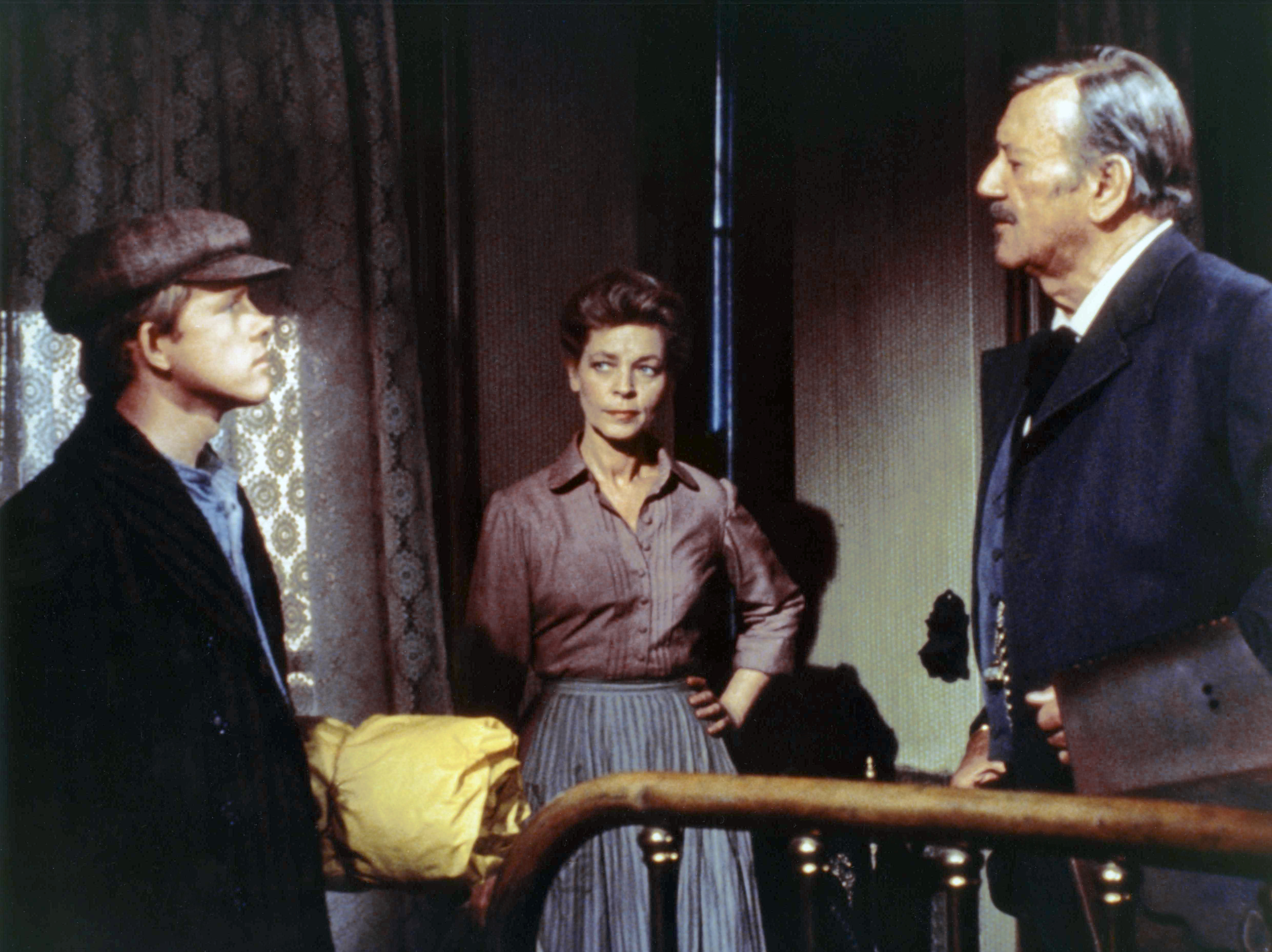 Ron Howard, Lauren Bacall and John Wayne in a scene from the 1976 movie "The Shootist." | Source: Getty Images