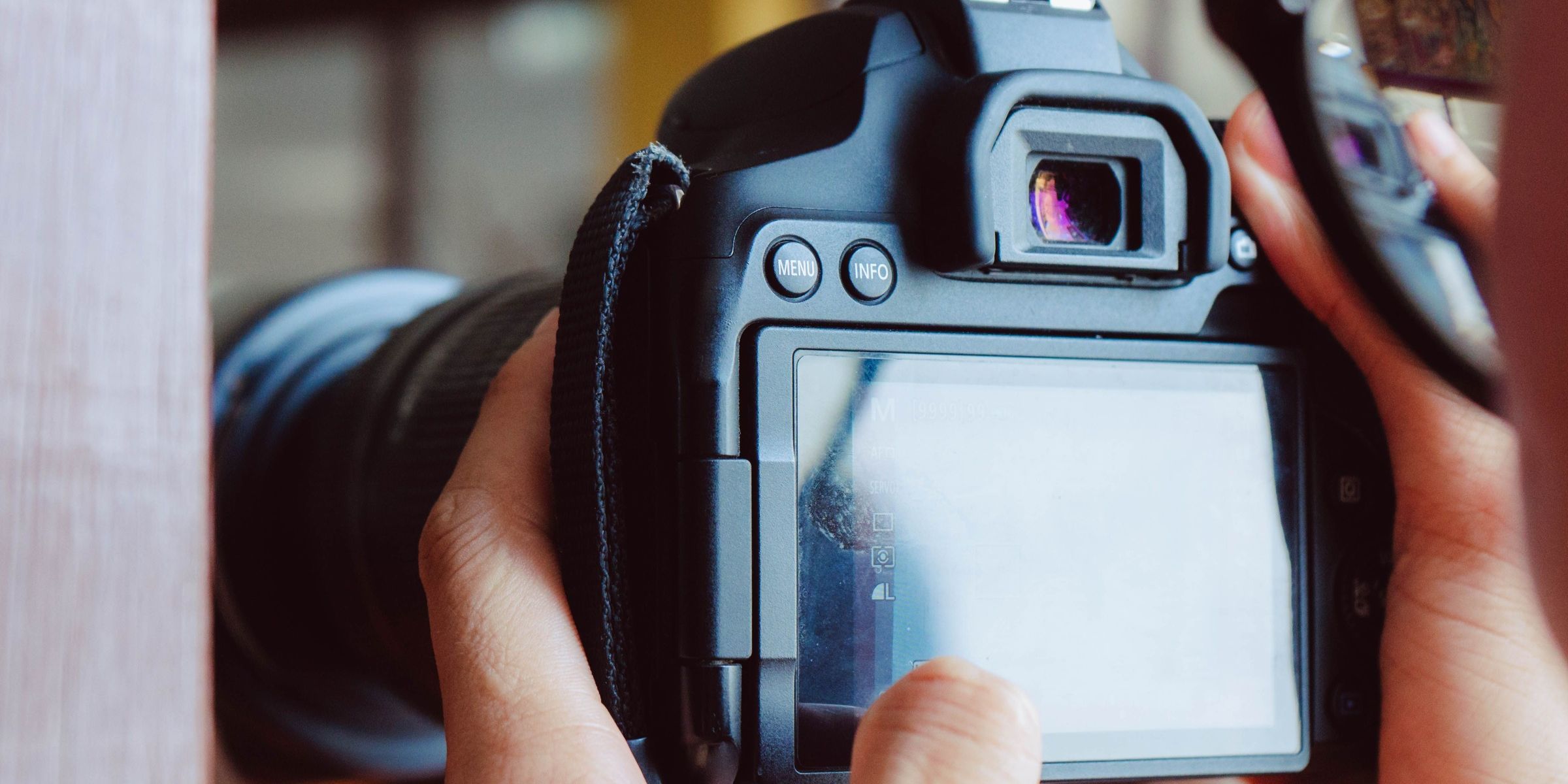 A close-up of a person holding a camera | Source: Pexels
